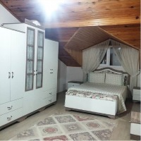 Özlem Hanım'ın mavi, gri ve morlarla renklenmiş enerjik evi